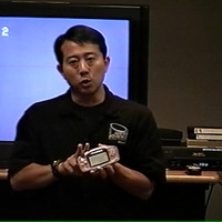 Steve Okimoto shows off the Game Boy Advance